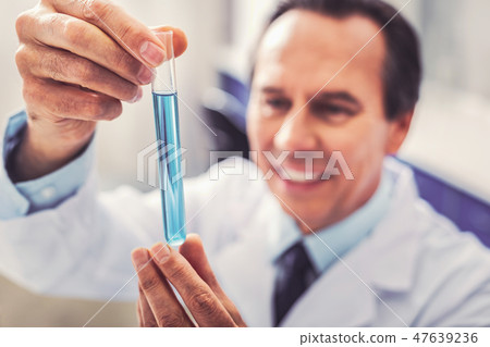 Clever medicine worker feeling happy after making breakthrough Clever medicine worker feeling happy after making breakthrough 47639236