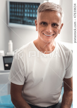 Grey-haired beaming man feeling happy Grey-haired beaming man feeling happy 47639634