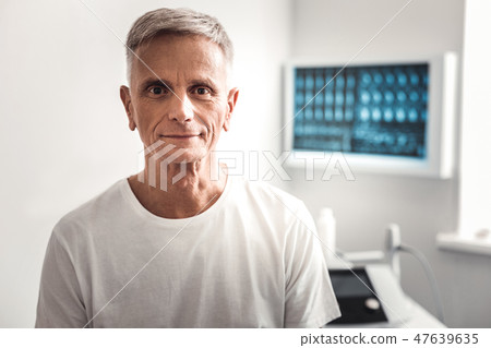 Hazel-eyed wrinkled man waiting for the doctor 47639635