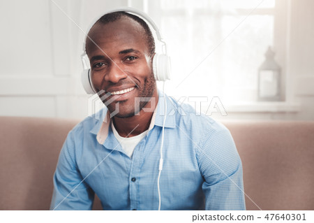 Nice cheerful man smiling to you Nice cheerful man smiling to you 47640301