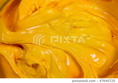 close up yellow color of oil paint. close up yellow color of oil paint. 47640720