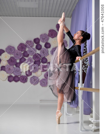 Ballerina in training hall 47641008