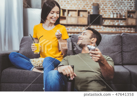 Happy brunette female looking at her boyfriend Happy brunette female looking at her boyfriend 47641358