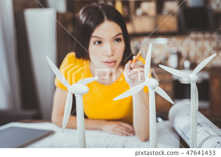 Concentrated engineer working at green energy project 47641433