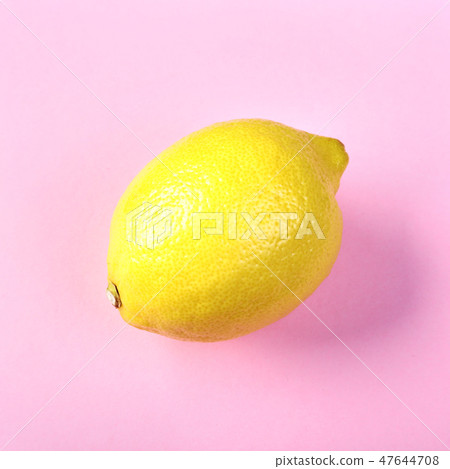 Fresh exotic lemon on a pink background. Fruit background. Top View. 47644708