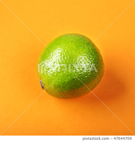 Fresh exotic lime on yellow background. Fruits background. Top view. 47644709