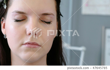 Young brunette woman with closed eyes. Young brunette woman with closed eyes. 47645785