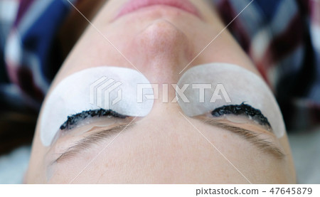 Beauty treatment. Closeup eyes in woman's face with paint on eyelashes. Botox and laminating Beauty treatment. Closeup eyes in woman's face with paint on eyelashes. Botox and laminating 47645879