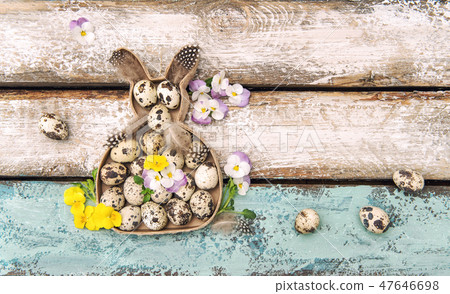 Easter decoration rabbit eggs pansy flowers 47646698