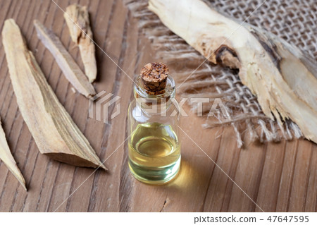 A bottle of white sandalwood essential oil 47647595