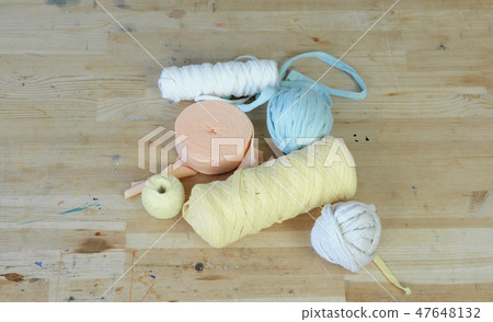 Workplace in sewing and weaving workshop with wooden table and yarn. 47648132