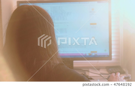 Working on computer. Unrecognizable young woman browsing internet pages in screen and makes Working on computer. Unrecognizable young woman browsing internet pages in screen and makes 47648192
