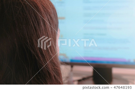 Working on computer. Unrecognizable young woman browsing internet pages in screen and makes Working on computer. Unrecognizable young woman browsing internet pages in screen and makes 47648193