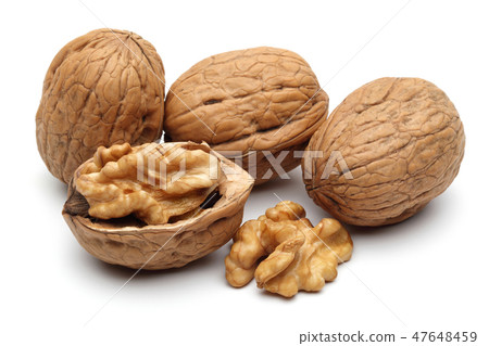 Walnuts and cracked walnut on white background Walnuts and cracked walnut on white background 47648459