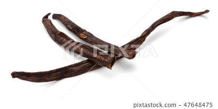 Vanilla bean with seeds on white background Vanilla bean with seeds on white background 47648475