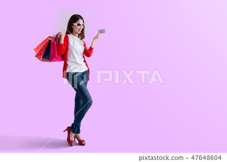 Young happy woman with shopping bags Young happy woman with shopping bags 47648604