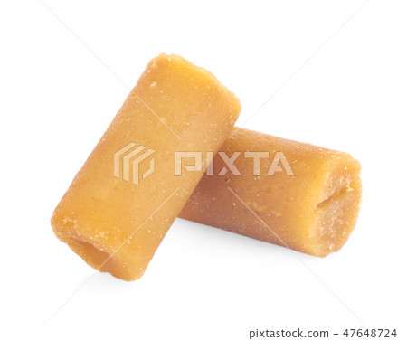 The palm sugar or Jaggery on white background The palm sugar or Jaggery on white background 47648724