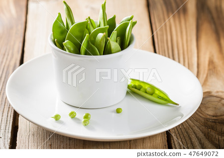 Green peas in a pods Green peas in a pods 47649072
