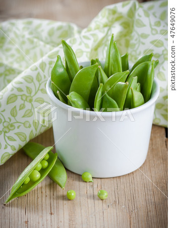 Green peas in a pods Green peas in a pods 47649076