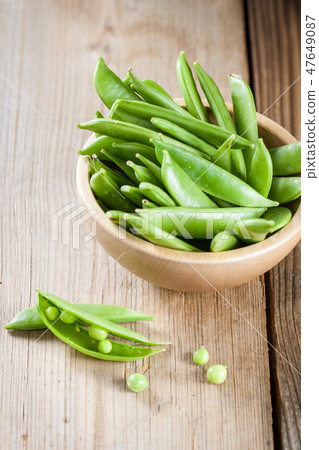 Green peas in a pods Green peas in a pods 47649087