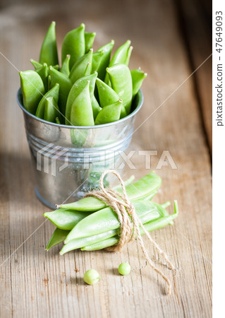 Green peas in a pods Green peas in a pods 47649093