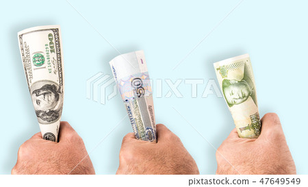 holding money firmly holding money firmly 47649549