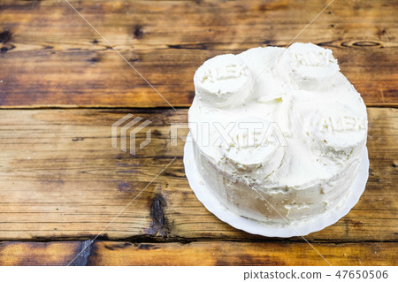 Homemade birthday's white cake for 7 year-old boy Round cake in brick shape. Right on photo Top 47650506