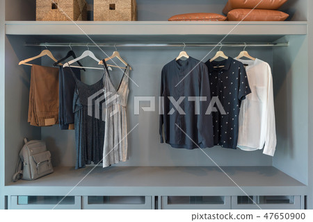 modern closet with clothes hanging modern closet with clothes hanging 47650900