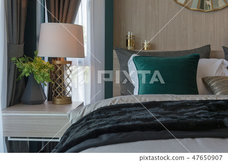 modern bedroom with set of pillows 47650907