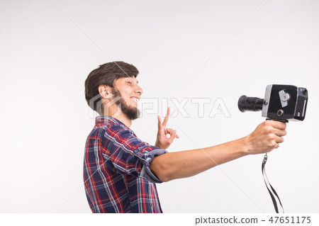 Technology, photography and people concept - Funny man in plaid shirt taking a selfie over white Technology, photography and people concept - Funny man in plaid shirt taking a selfie over white 47651175