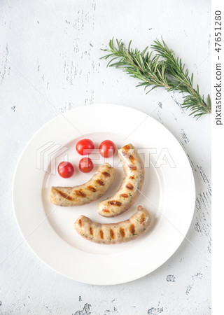 Grilled sausages with cherry tomatoes Grilled sausages with cherry tomatoes 47651280