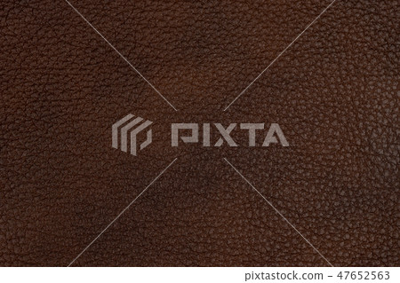 Close-up brown leather texture to background. Close-up brown leather texture to background. 47652563