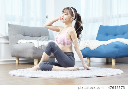 Stretching, exercise, fitness, yoga, pilates, young woman 47652573