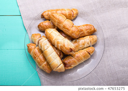 Sausage in the dough, top view 47653275