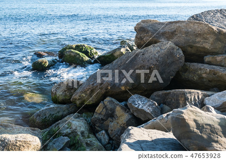 close up big rock stack at sea close up big rock stack at sea 47653928