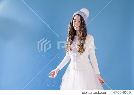 Portrait of beautiful girls under snow in winter 47654069