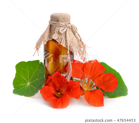 Nasturtium flowers with a pharmaceutical bottle. 47654453
