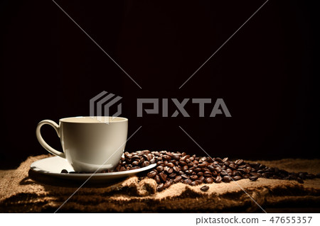Cup of coffee and coffee beans Cup of coffee and coffee beans 47655357