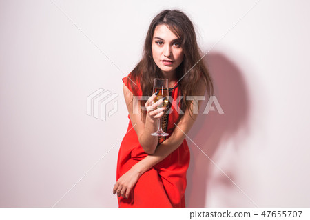Portrait of a beautiful celebrating woman. Holiday lifestyle on white background. Female model in Portrait of a beautiful celebrating woman. Holiday lifestyle on white background. Female model in 47655707