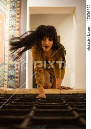 Beautiful Moroccan Girl in Short Golden Dress crawling by lattice indoor of Picturesque Dar Si Said Beautiful Moroccan Girl in Short Golden Dress crawling by lattice indoor of Picturesque Dar Si Said 47656271