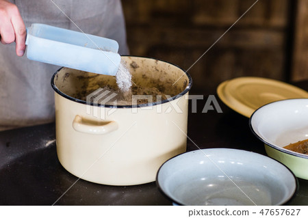 Closeup of the hands of men to knead the dough for bread 47657627