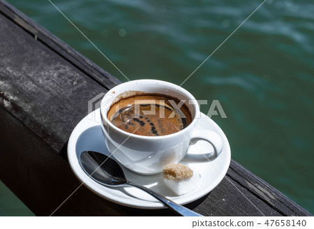 A small white porcelain espresso cup A small white porcelain espresso cup 47658140