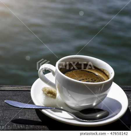 A small white porcelain espresso cup A small white porcelain espresso cup 47658142