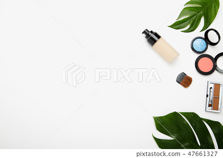 Make up products and brushes on white Make up products and brushes on white 47661327
