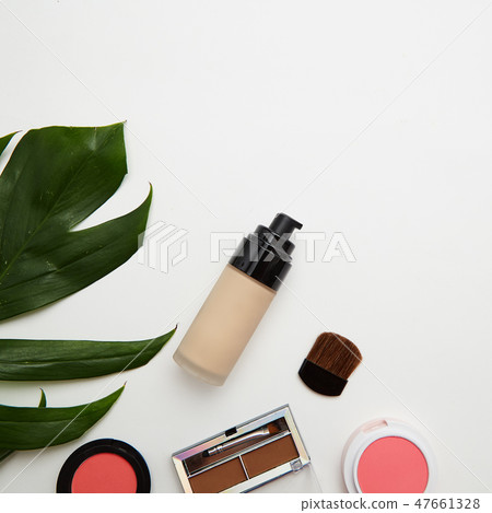 Make up products and brushes on white Make up products and brushes on white 47661328