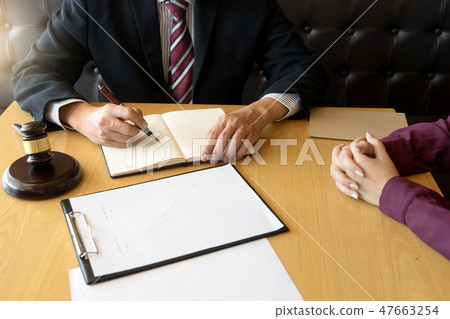 Judge gavel with Justice lawyers having team 47663254