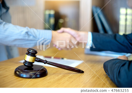Justice lawyers Handshake to businessman or client 47663255