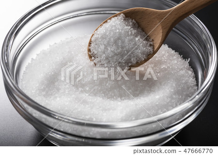 Salt and wooden spoon 47666770