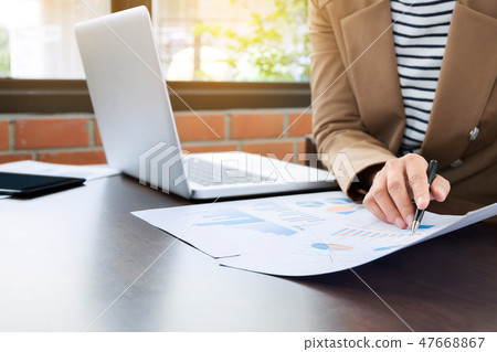 close up business executive working with laptop an data document close up business executive working with laptop an data document 47668867