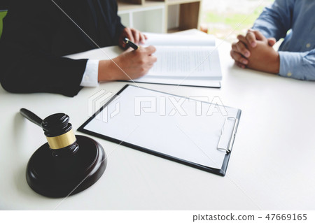 Judge gavel with legal documents, lawyer consulting with busines Judge gavel with legal documents, lawyer consulting with busines 47669165